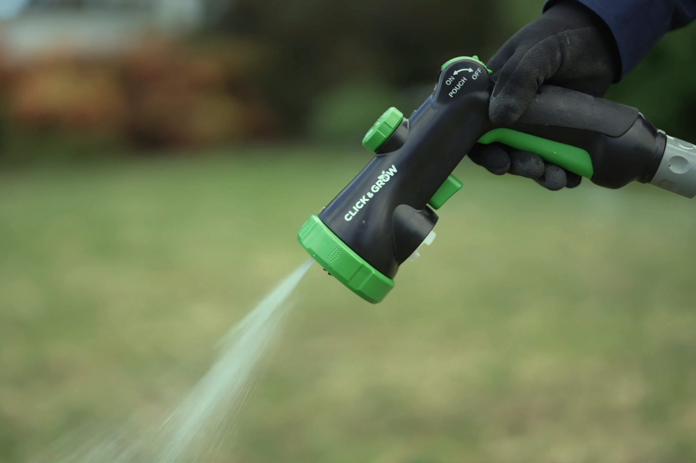 Hand watering the garden with a trigger nozzle
